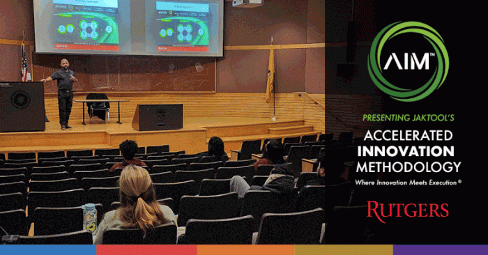 A presenter speaking to Rutgers students in an auditorium